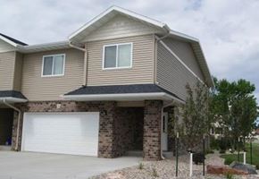 Fargo apartment for rent - a house with a white garage door in front of it