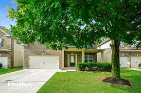Newnan house for rent - A house with a tree in front of it.