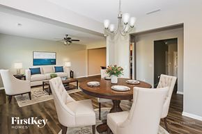Statesville house for rent - A dining room with a wooden table set for four.