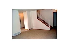 Moorhead townhouse for rent - a room with a staircase and a white wall