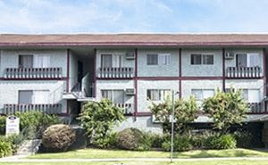 N.Hollywood apartment for rent - A white building with a red roof and balconies.
