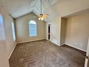 Virginia Beach house for rent - A room with a ceiling fan and carpeted floor.