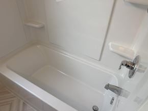 Wausau apartment for rent - A white bathtub with a silver faucet and handle.