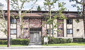 N. Hollywood apartment for rent - A building with a red brick wall and a glass door.