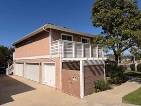 Dana Point apartment for rent - A two-story house with a garage on the side.