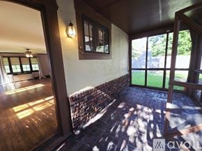 Memphis house for rent - A spacious room with wooden floors and a staircase.