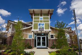 Denton apartment for rent - a large building with a sign on the front of it