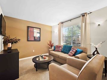Metairie apartment for rent - a living room with a couch and a table