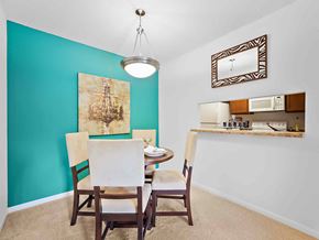 Mandeville apartment for rent - a dining room with a table and chairs