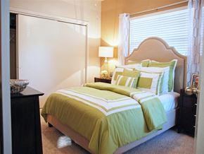 Irving apartment for rent - a bedroom with a bed and a dresser and a window