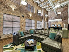 Round Rock apartment for rent - an office lobby with couches and chairs and a table