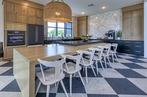 Belton apartment for rent - A kitchen with a checkered floor and a long table with chairs.