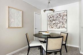 Littleton apartment for rent - A dining room with a table and chairs.