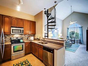 Tampa apartment for rent - a kitchen with stainless steel appliances and granite counter tops