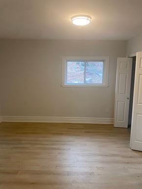 Bedford apartment for rent - A room with a window and a door.