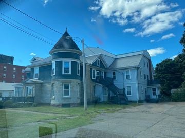 Amherst apartment for rent - A large house with a tower-like structure on the roof.