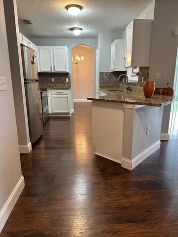 Deltona house for rent - A kitchen with a white counter and wooden floors.