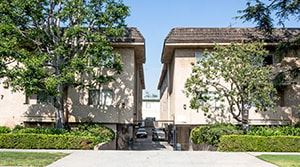 Los Angeles apartment for rent - A car is parked in the driveway of a two-story house.