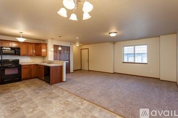 Summerset apartment for rent - A kitchen with a microwave, oven, and cabinets.