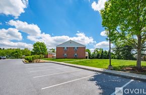 Millersville apartment for rent - A parking lot with a building in the background.