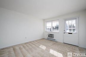 Millersville apartment for rent - A room with a carpeted floor and a window with blinds.