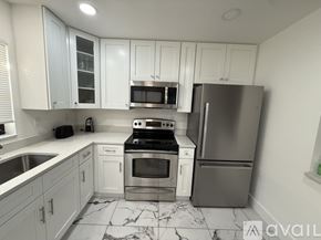 Rotonda West apartment for rent - A bed with a purple bedspread is in the image.