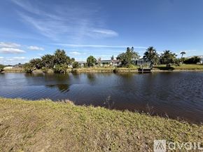 Rotonda West apartment for rent - A grassy field with trees and a partly cloudy sky.