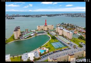 St. Petersburg condo for rent - A red arrow points to a building in a large complex with a pool.