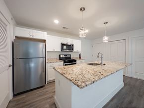 Mt. Laurel apartment for rent - A kitchen with white cabinets and a white counter top.