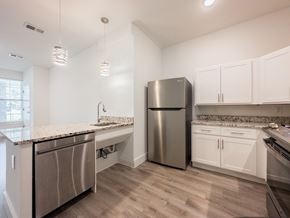 Mt. Laurel apartment for rent - A grassy field with a building in the background.