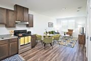 Herndon apartment for rent - A kitchen with a dining table and chairs.