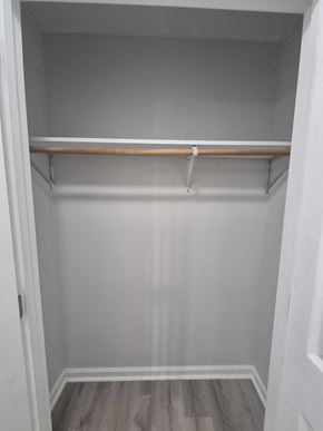 Oak Grove house for rent - A white closet with a shelf and a grey floor.