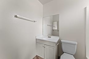Burbank apartment for rent - A white toilet sits next to a sink in a small bathroom.