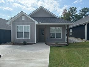Little Rock house for rent - A house with a grey roof and a grey front porch.