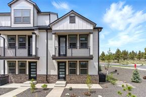 Bend apartment for rent - A two-story house with a balcony on the second floor.