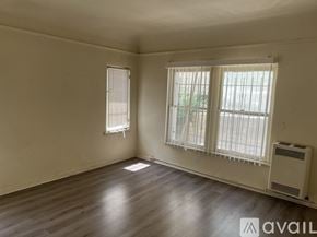 Los Angeles apartment for rent - A room with a window and a wall-mounted air conditioner.