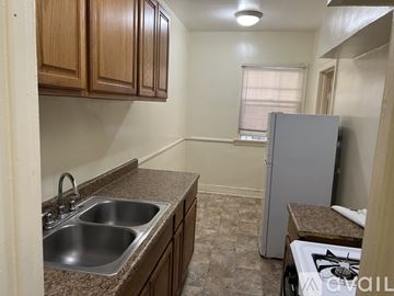 Los Angeles apartment for rent - A kitchen with a sink, stove, and refrigerator.