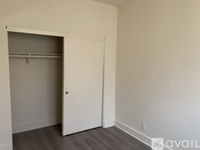 Los Angeles apartment for rent - A room with a white door and a grey wall.