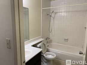 Los Angeles apartment for rent - A bathroom with a toilet, sink, and bathtub.