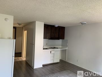 Los Angeles apartment for rent - A kitchen area with white cabinets and a countertop.