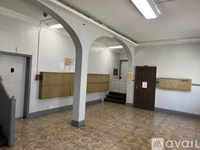 Los Angeles apartment for rent - A room with a white wall and a brown door.