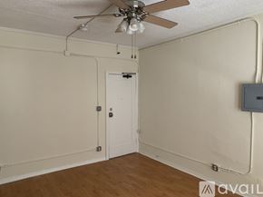 Los Angeles apartment for rent - A room with a ceiling fan and a door.
