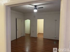 Los Angeles apartment for rent - A room with wooden floors and a ceiling fan.