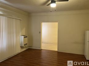 Los Angeles apartment for rent - A room with wooden flooring and a ceiling fan.