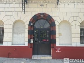 Los Angeles apartment for rent - The building has a black door with a red frame.