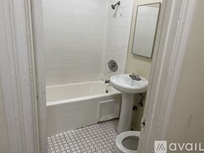 Los Angeles apartment for rent - A white bathroom with a toilet, sink, and bathtub.