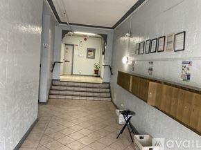 Los Angeles apartment for rent - A hallway with a staircase leading to a door at the end.