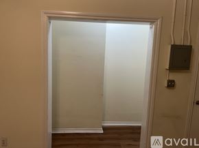 Los Angeles apartment for rent - A room with a door and a wall socket.