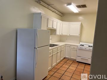 Los Angeles apartment for rent - A kitchen with white appliances and cabinets.