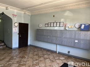 Los Angeles apartment for rent - A room with a brown door and a wall of electrical boxes.